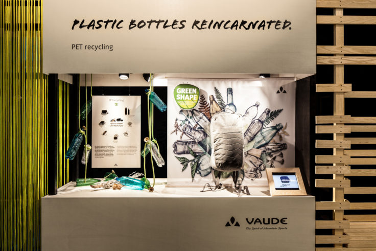 VAUDE trade fair stand at ISPO 2017 with products made from recycled PET bottles